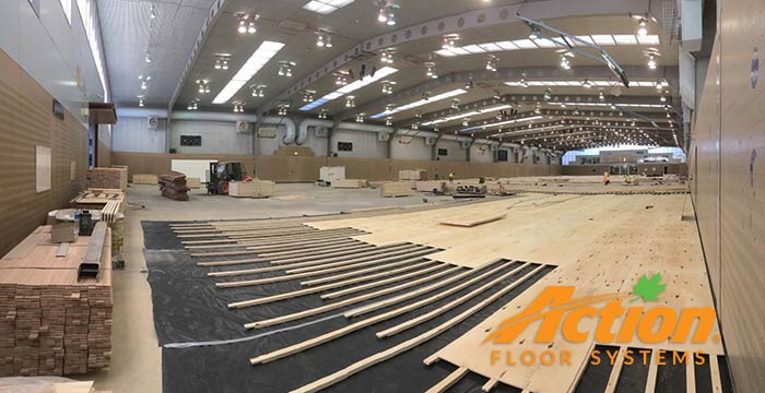 Installing the Action Cush II flooring system at AIS.