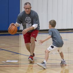 basketball coach with player