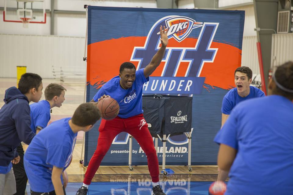 OKC thunder with solid rock basketball
