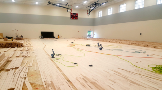 hardwood sports floor installation progress